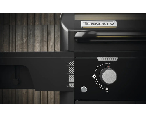 Detailansicht eines schwarzen Tenneker Gasgrills mit Drehknopf zur Temperaturregelung.