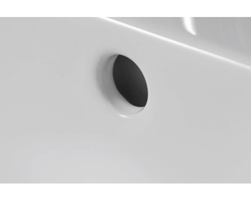 Detailaufnahme eines Ablauflochs in einem Waschbecken