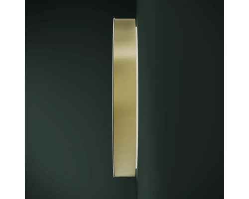 Runder Spiegel mit Metallrahmen an der Wand