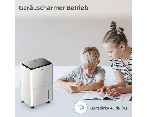 Szene mit Raumentfeuchter und Kindern beim Lernen am Tisch.