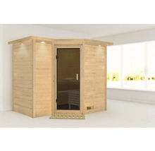 Ecksauna aus Holz mit Glastür und Beleuchtung in einem hellen Raum.
