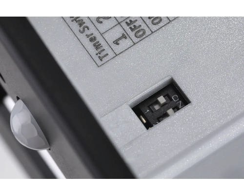 Detailaufnahme eines Bewegungsmelders mit Timer Schalter