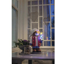 Dekorative Bärenfigur mit LED Weihnachtsbaum auf einem Tisch in einem Raum.