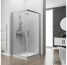 Badezimmer mit Duschkabine, Waschtisch und Heizkörper