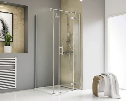 Duschkabine mit Glastüren und Handtuchheizkörper im Badezimmer