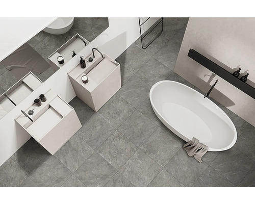 Modernes Badezimmer mit grauen Fliesen, Waschbecken und Badewanne