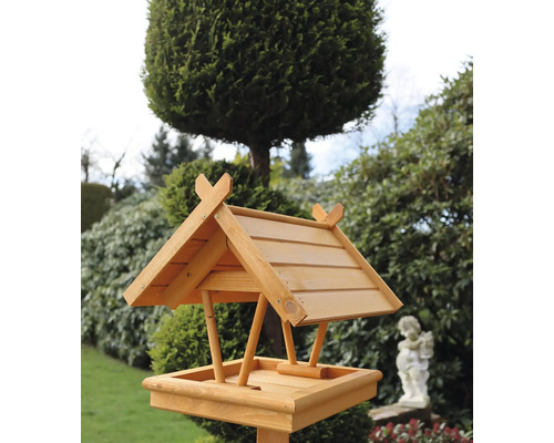 Vogelhaus aus Holz mit Dach im Garten