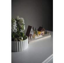 Dekorative Holz-Weihnachtslandschaft mit Häusern und Weihnachtsmann