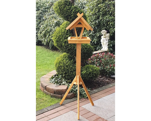 Holzvogelhaus mit Ständer im Garten