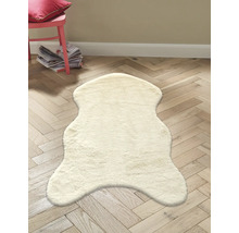 Dekorativer, heller Schaffell-Teppich auf Holzboden