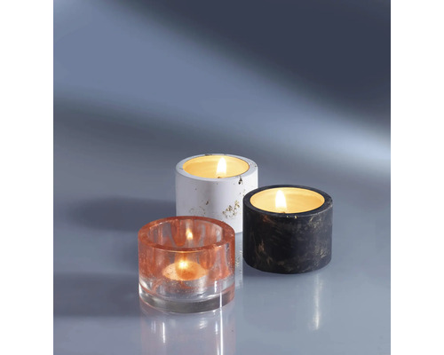 Drei Teelichthalter aus unterschiedlichen Materialien