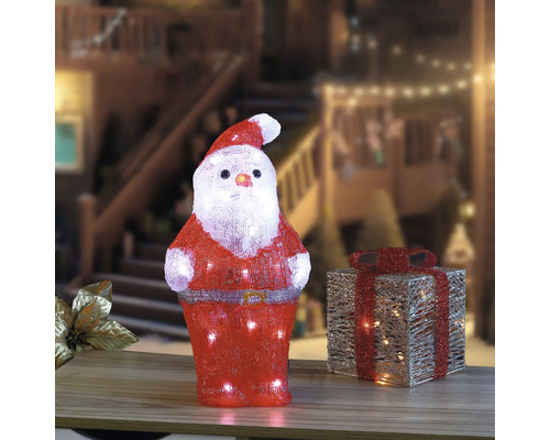 Leuchtender Weihnachtsmann und Geschenk als Weihnachtsdekoration