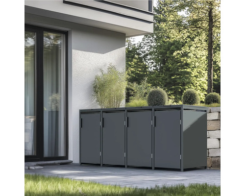 Mülltonnenbox aus Metall mit Pflanzschale vor einem Haus