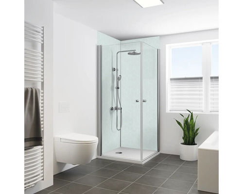 Helles Badezimmer mit Dusche, Toilette, Heizkörper und Pflanze