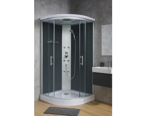 Komplette Duschkabine mit Duschkopf und Armaturen in einem Badezimmer.