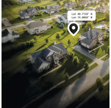 Luftaufnahme einer Wohngegend mit Häusern, Gärten und Straßen