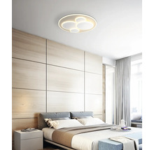 Schlafzimmer mit modernem Design und runder Deckenleuchte