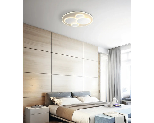 Schlafzimmer mit modernem Design und runder Deckenleuchte