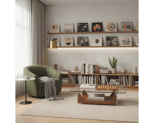 Wohnzimmer mit Sessel, Couchtisch und Bücherregal unter Schallplattensammlung