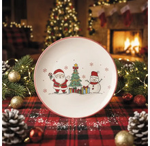 Weihnachtsteller mit Motiven von Weihnachtsmann, Christbaum und Schneemann in einer festlich dekorierten Umgebung mit Kamin.