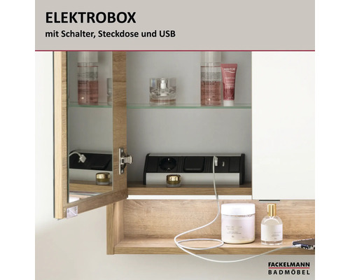 Fackelmann Elektrobox für Spiegelschränke mit Steckdose, Schalter und USB-Anschluss montiert in einem Badezimmerschrank mit Holzdekor.