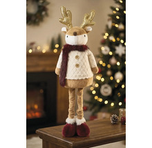 Rentier-Weihnachtsfigur aus Plüsch mit goldenem Geweih und langen Beinen in einer hellen, festlichen Umgebung mit geschmücktem Weihnachtsbaum.