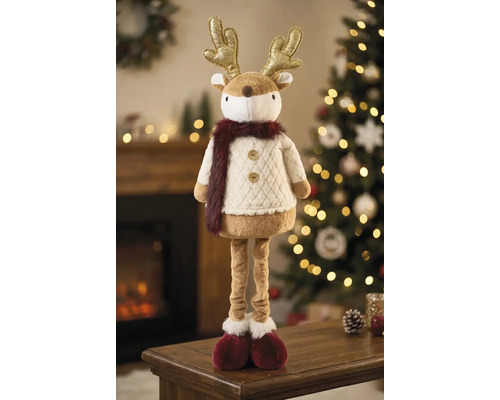 Rentier-Weihnachtsfigur aus Plüsch mit goldenem Geweih und langen Beinen in einer hellen, festlichen Umgebung mit geschmücktem Weihnachtsbaum.