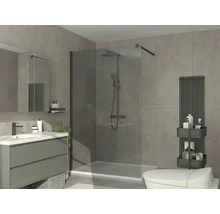 Modernes Badezimmer mit begehbarer Glasdusche, grauem Waschtisch, weißem Waschbecken, schwarzem Heizkörper und grauen Fliesen.
