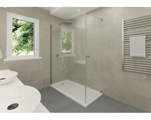 Modernes Badezimmer mit Glasdusche, weißer Duschwanne, Handtuchheizkörper und Doppelwaschtisch vor beigefarbenen Wandfliesen.