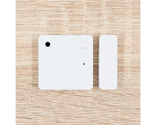 Tür- und Fenstersensor für Smart Home Systeme, bestehend aus einem quadratischen Sensor und einem schmalen Kontaktmagneten.