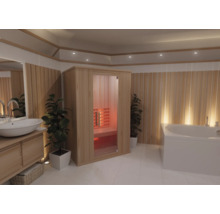 Modernes helles Badezimmer mit Infrarotkabine aus Holz, Glastür, Waschtisch mit weißem Waschbecken und großer weißer Badewanne.