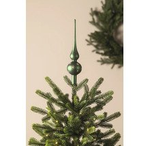 Christbaumspitze mit Sternenmuster auf einem künstlichen Weihnachtsbaum mit Beleuchtung.