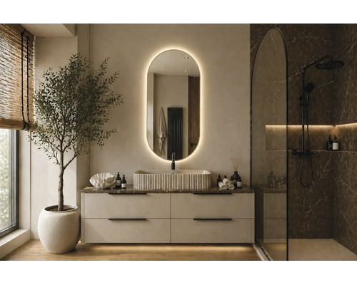 Modernes Badezimmer mit hellem Waschtischunterschrank, strukturiertem Aufsatzbecken, ovalem hinterleuchtetem Spiegel und Dusche in dunkler Marmoroptik.