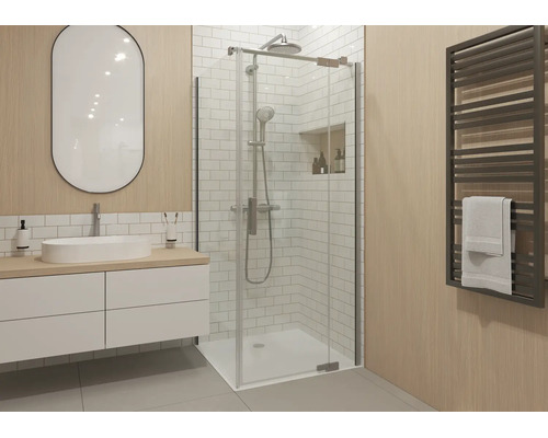 Modernes Badezimmer mit einer Glas-Duschkabine, einem weißen Waschtisch mit ovalem Spiegel und einem Handtuchheizkörper an einer Holzoptik-Wand.