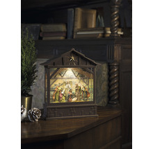 Dekorative Weihnachtskrippe mit Beleuchtung und traditioneller Szene.