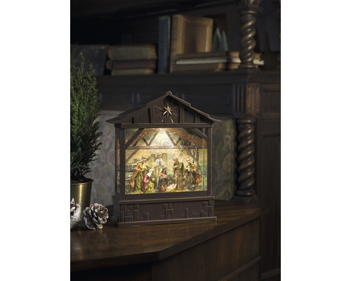 Dekorative Weihnachtskrippe mit Beleuchtung und traditioneller Szene.