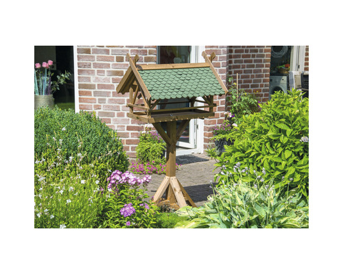 Vogelhaus aus Holz mit Dach im Garten