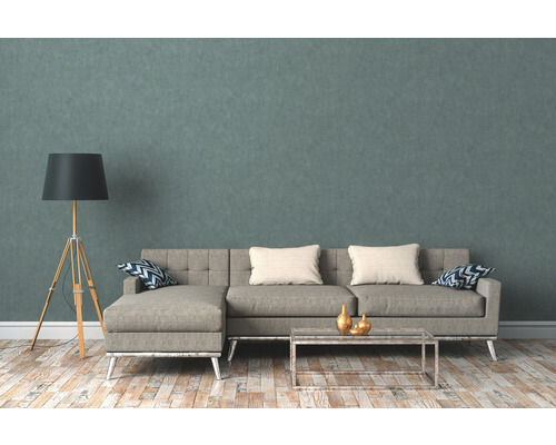 Wohnzimmer mit Ecksofa, Stehlampe und Couchtisch