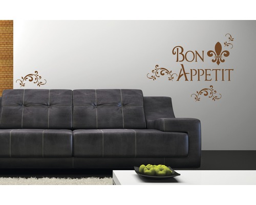 Wanddekoration mit dem Schriftzug Guten Appetit