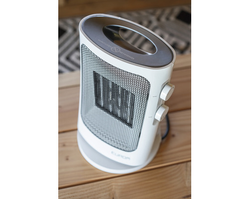 Elektrischer Heizlüfter mit runder Basis und Griff