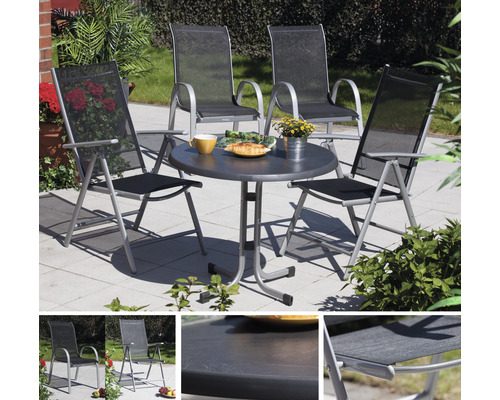 Gartensitzgruppe mit rundem Tisch und vier Stühlen im Außenbereich