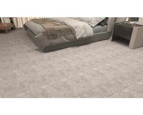 Bodenfliesen in einem Schlafzimmer mit Bett und Nachttisch