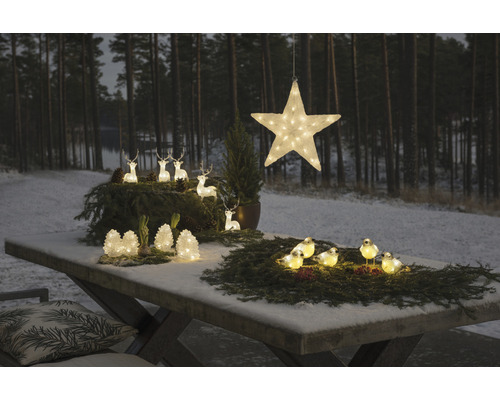 Weihnachtliche Tischdekoration mit Stern, Rehen und Vögeln, beleuchtet