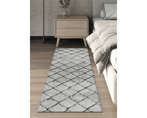 Teppich mit Rautenmuster im Schlafzimmer