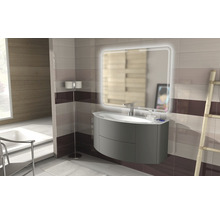 Modernes Badezimmer mit Waschtisch, beleuchtetem Spiegel und Fliesenwand