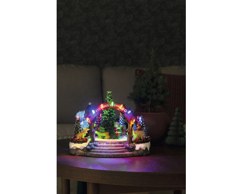 Dekorative Zoo-Weihnachtslandschaft mit Beleuchtung auf einem Tisch