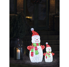 Beleuchtete Schneemannfiguren als Weihnachtsdekoration vor einem Hauseingang.