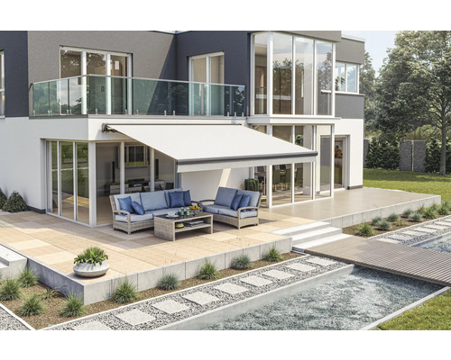 Haus mit Markise, Terrasse und Gartenmöbeln
