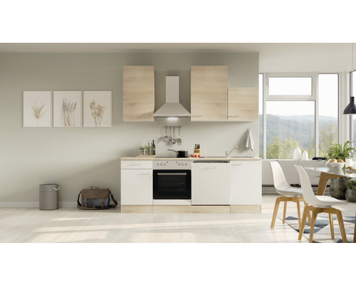 Küchenblock Flex Well Samoa 8210 weiß/Sonoma Eiche 220 cm inkl. Einbaugeräte Helle Küche mit Ober- und Unterschränken, Dunstabzugshaube und Elektrogeräten in einem modern eingerichteten Raum.