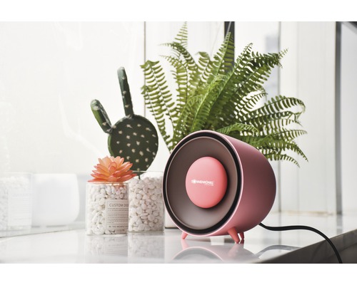 Pinkfarbene Heizlüfter mit Dekoration